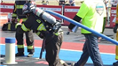 Blue Team Firefighter Continues Forward with Hose