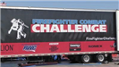 Firefighter Combat Challenge Banner on the Side of a Truck