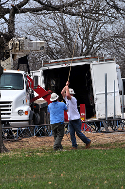 Two Tower Construction Workers on the Ground