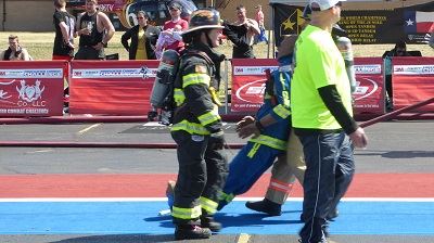 Blue Team Firefighter Hauling a Rescue Dummy 2